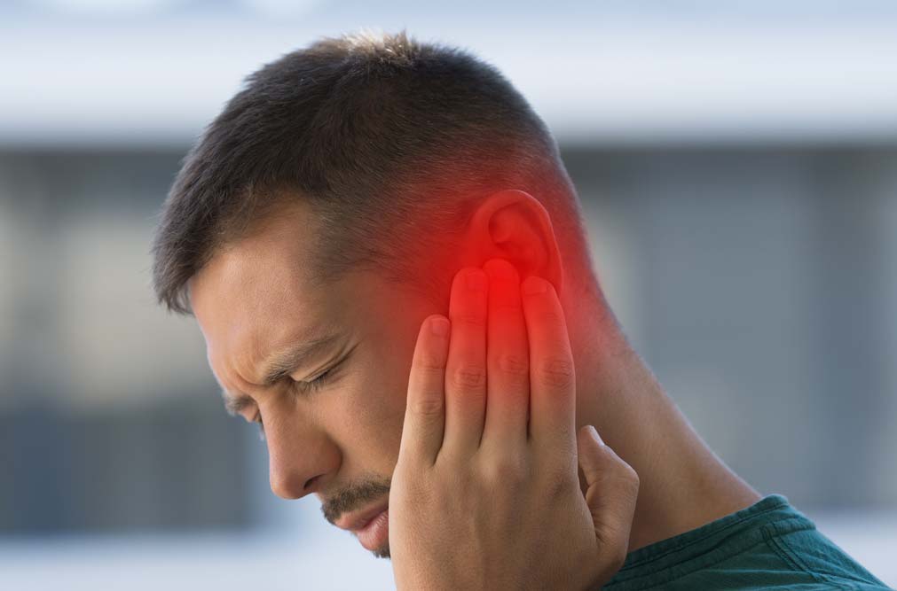 This is image of a man suffering Tinnitus, a condition where the person experiences the sensation of a sound in their ears without there being an external source.
